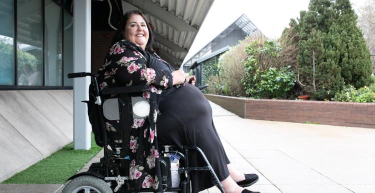 Woman in a wheelchair outside