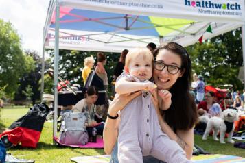 A mother and baby at a community event