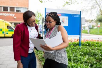 Two women looking at a file