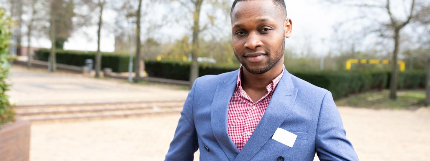 Man standing in a court yard